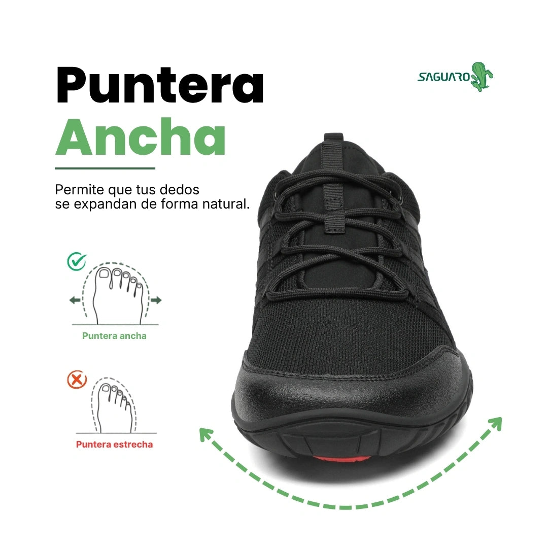 Vista frontal zapatilla trekking negra con puntera ancha protegida.