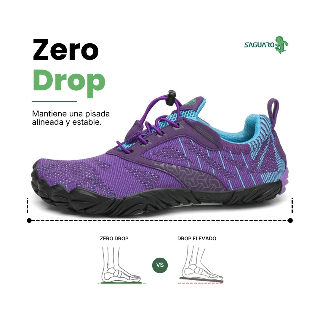 Vista lateral zapatilla barefoot púrpura, diseño ergonómico y suela plana.