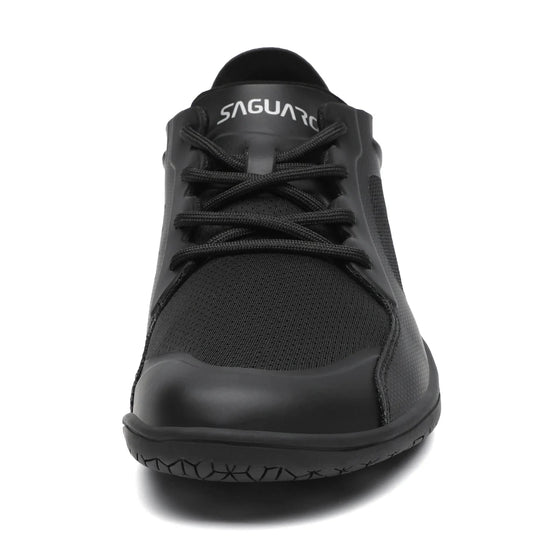 Vista superior zapatilla minimalista negra, espacio para dedos.