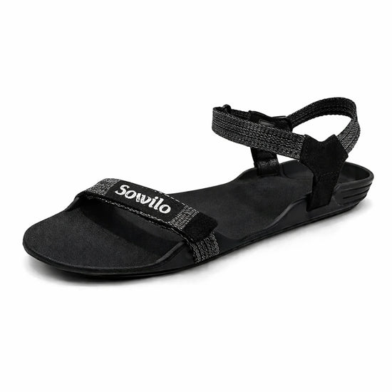 Sandalia barefoot Sowilo Raido negra vista lateral principal. 