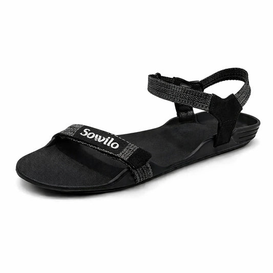 Sandalia barefoot Sowilo Raido negra vista lateral principal. 