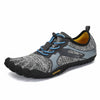Zapatilla barefoot Saguaro Fast I gris vista diagonal mostrando diseño deportivo minimalista.