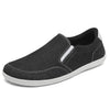 Zapatilla casual sin cordones negra, estilo alpargata minimalista.