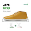 Vista lateral de zapatos barefoot formales amarillos, diseño elegante y minimalista.
