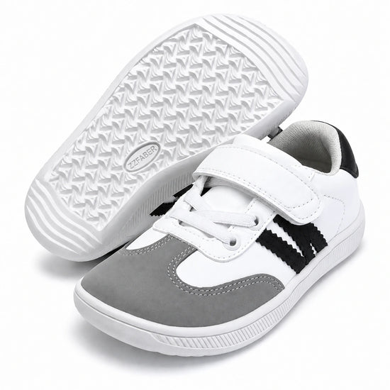 Suela flexible y antideslizante de la zapatilla barefoot infantil ZZfaber Kids Niza I blanco con negro.