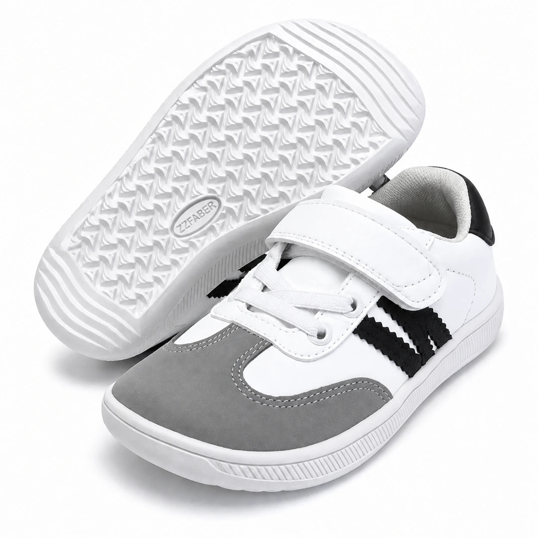 Suela flexible y antideslizante de la zapatilla barefoot infantil ZZfaber Kids Niza I blanco con negro.