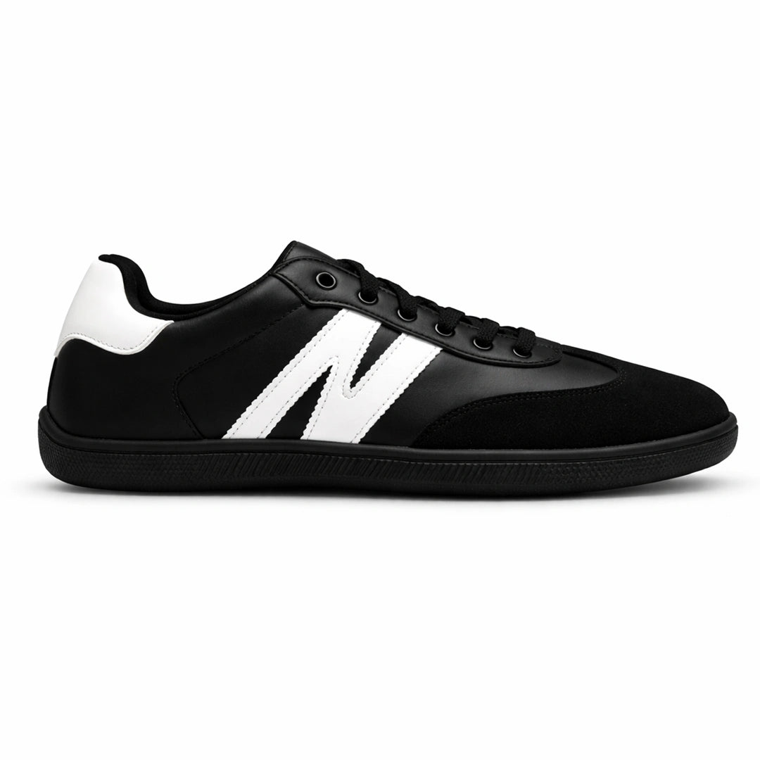 Zapatilla barefoot ZZfaber Niza I negra con blanco vista lateral.